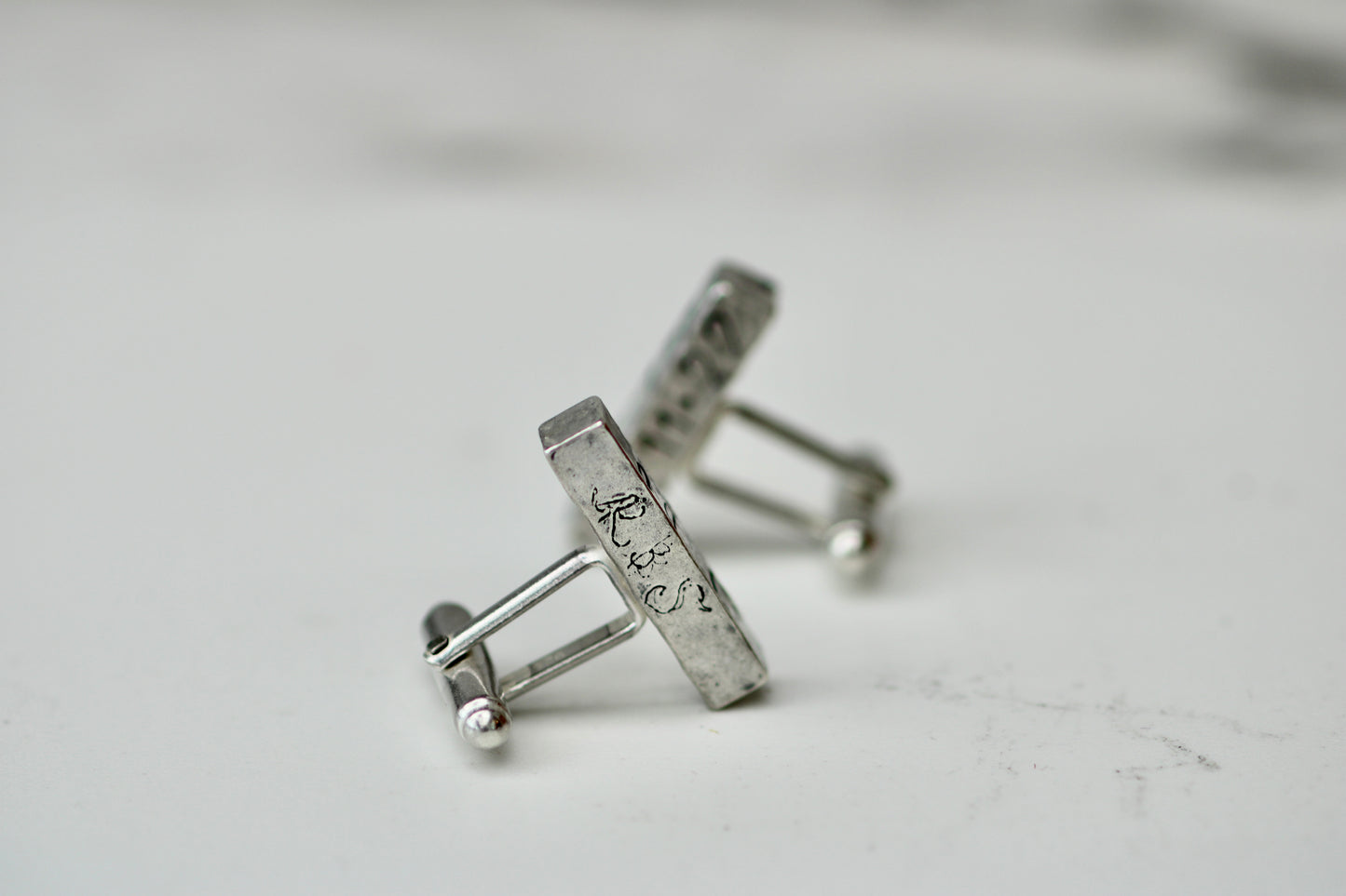 Handcrafted personalised cufflinks in eco silver with engravings, perfect for weddings and special occasions.