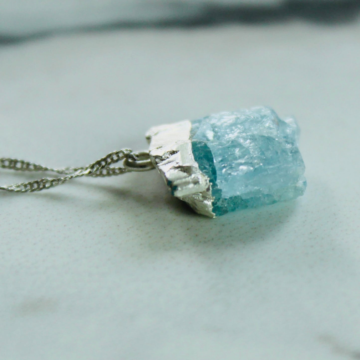 Raw aquamarine pendant