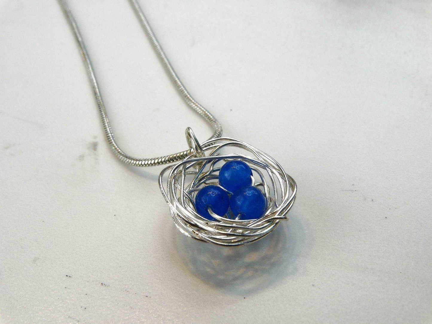 Birds nest pendant, necklace with blue eggs | Necklace | Louella Jewellery