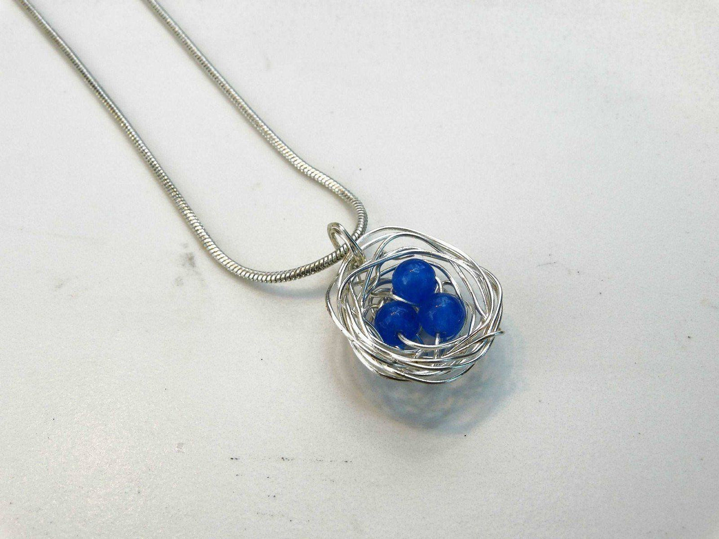 Birds nest pendant, necklace with blue eggs | Necklace | Louella Jewellery