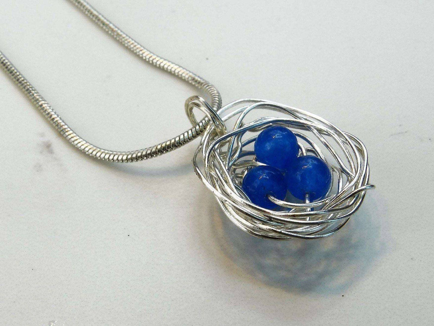 Birds nest pendant, necklace with blue eggs | Necklace | Louella Jewellery
