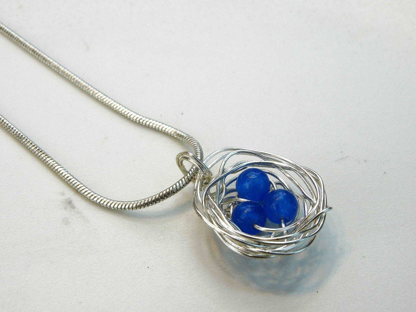 Birds nest pendant, necklace with blue eggs | Necklace | Louella Jewellery