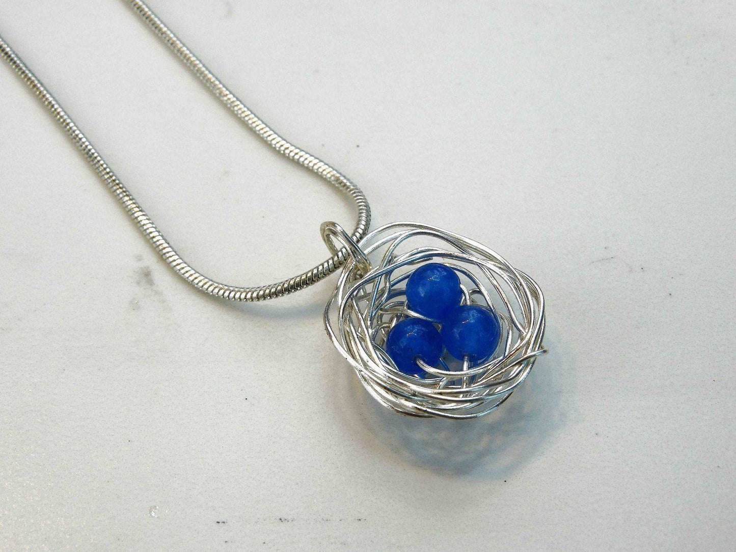 Birds nest pendant, necklace with blue eggs | Necklace | Louella Jewellery