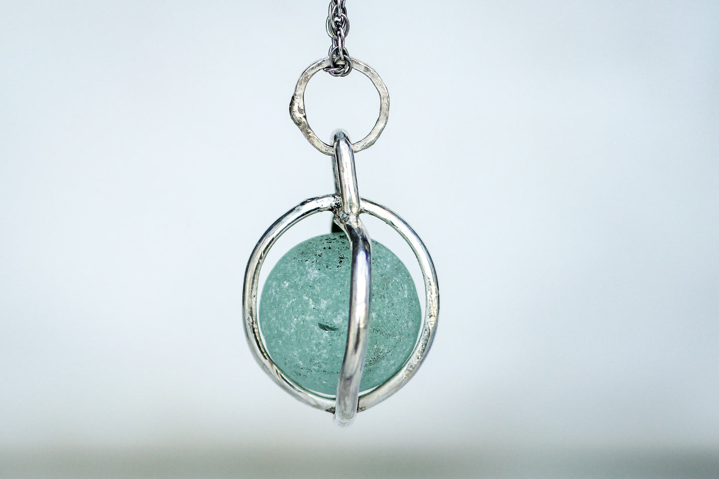 Ocean treasure necklace featuring authentic Victorian Codd marble in silver cage