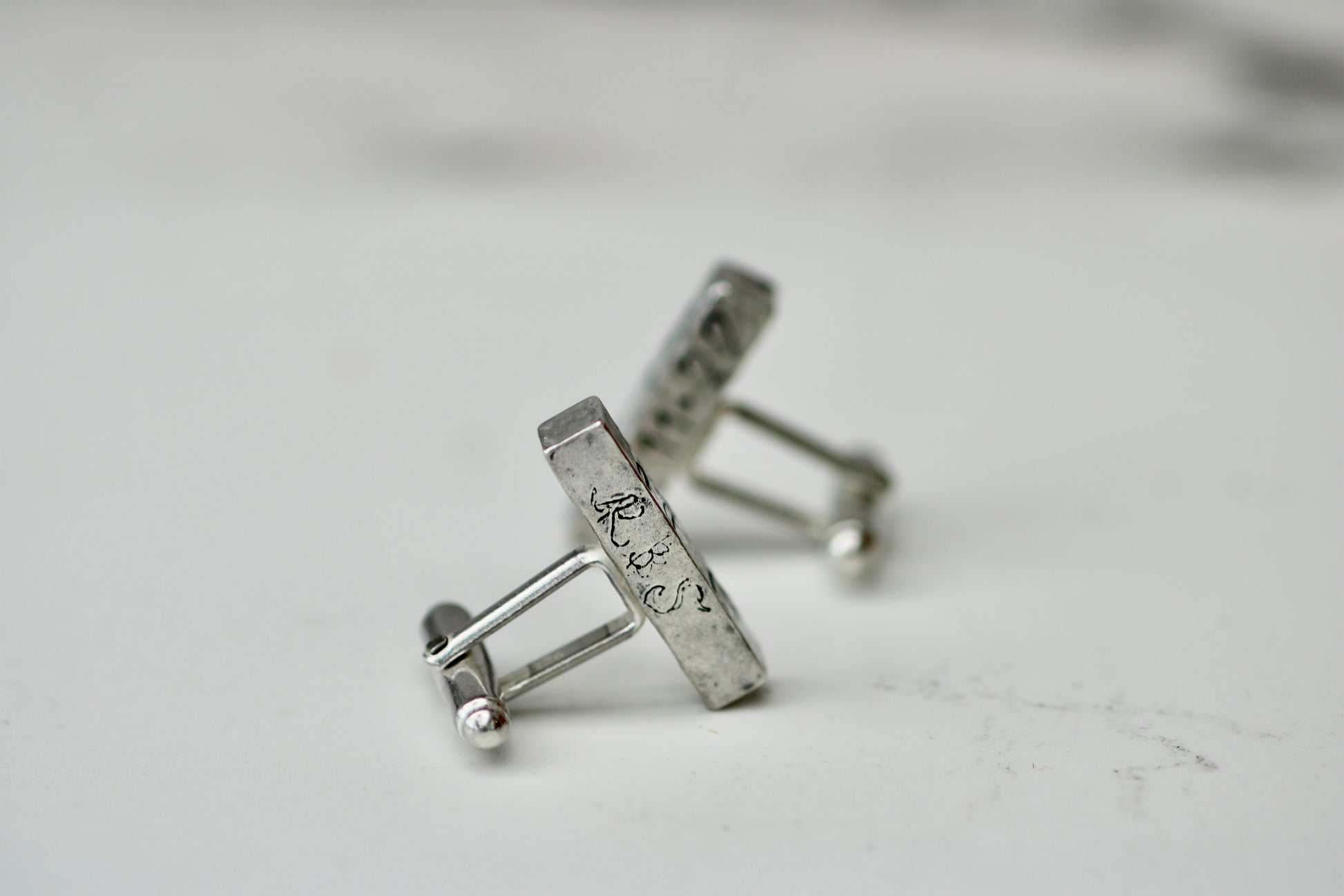 Handcrafted personalised cufflinks in eco silver with engravings, perfect for weddings and special occasions.