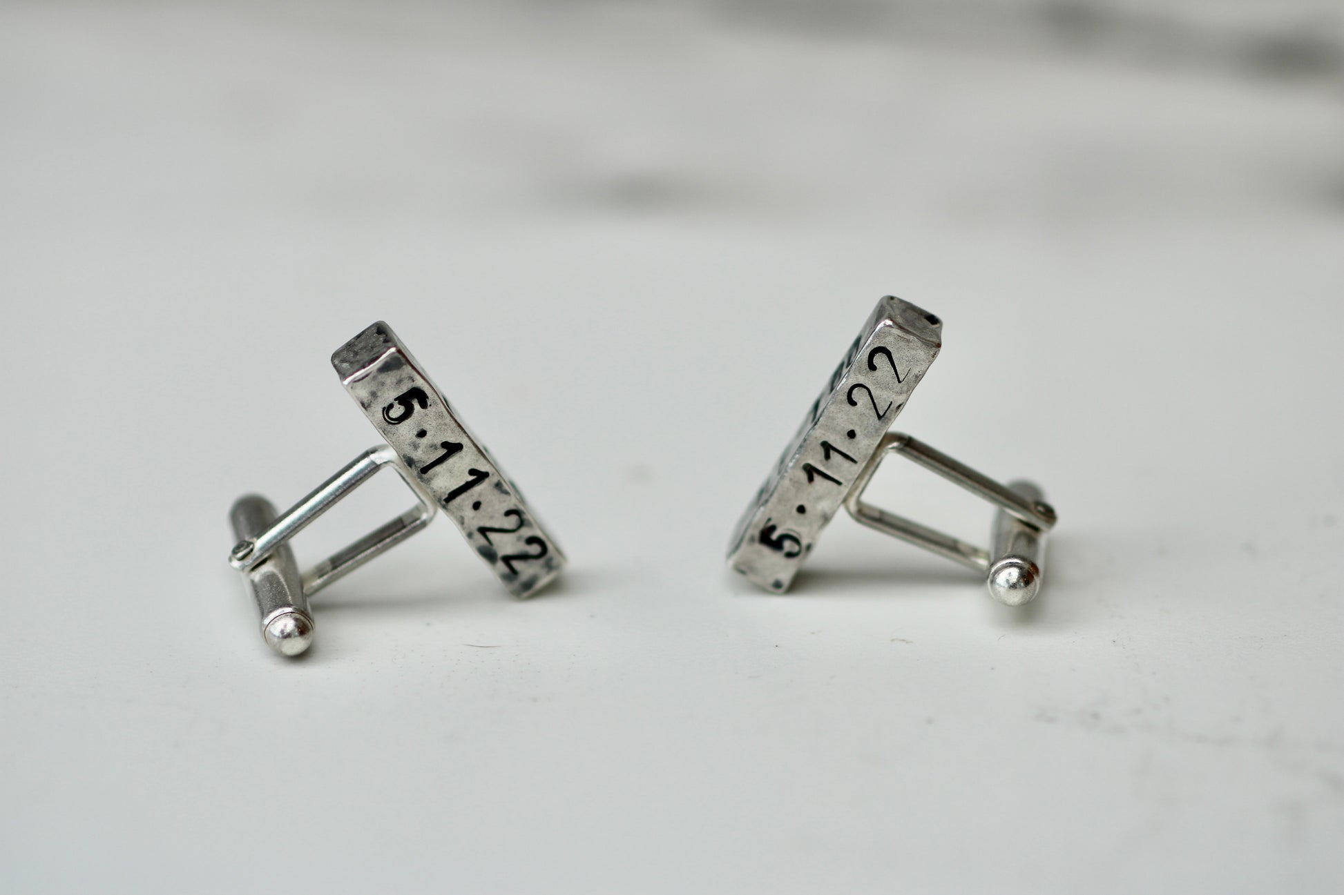 Handcrafted eco silver cufflinks engraved with wedding date, perfect for personalized gifts.