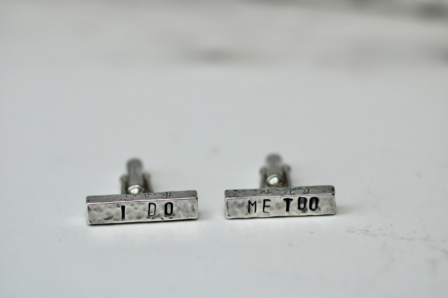 Handcrafted eco silver cufflinks engraved with 'I DO' and 'ME TOO' for personalized wedding gifts.