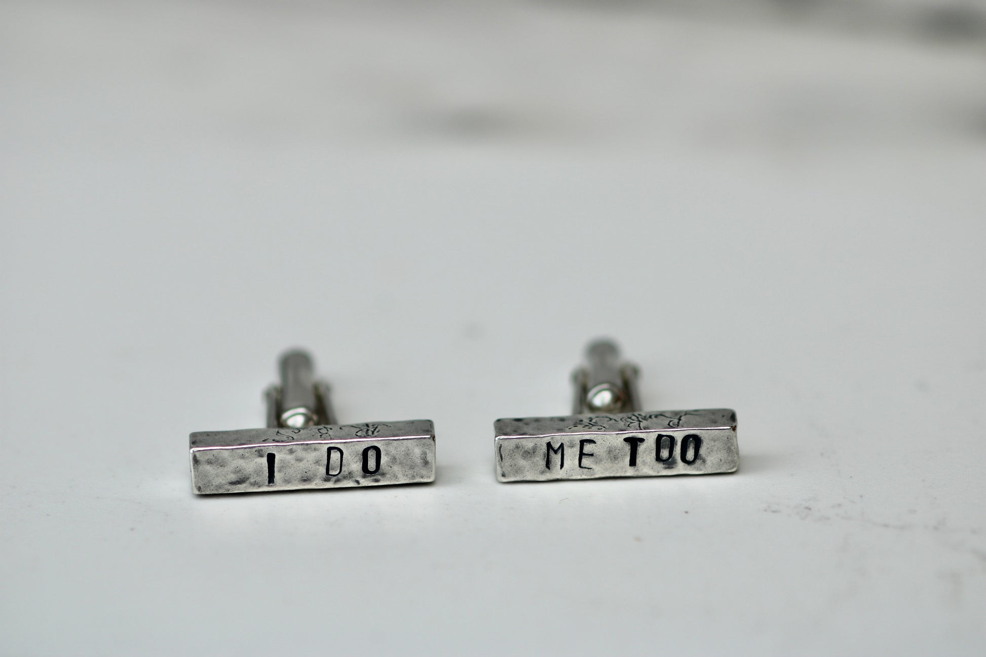 Handcrafted eco silver cufflinks engraved with 'I DO' and 'ME TOO' for personalized wedding gifts.
