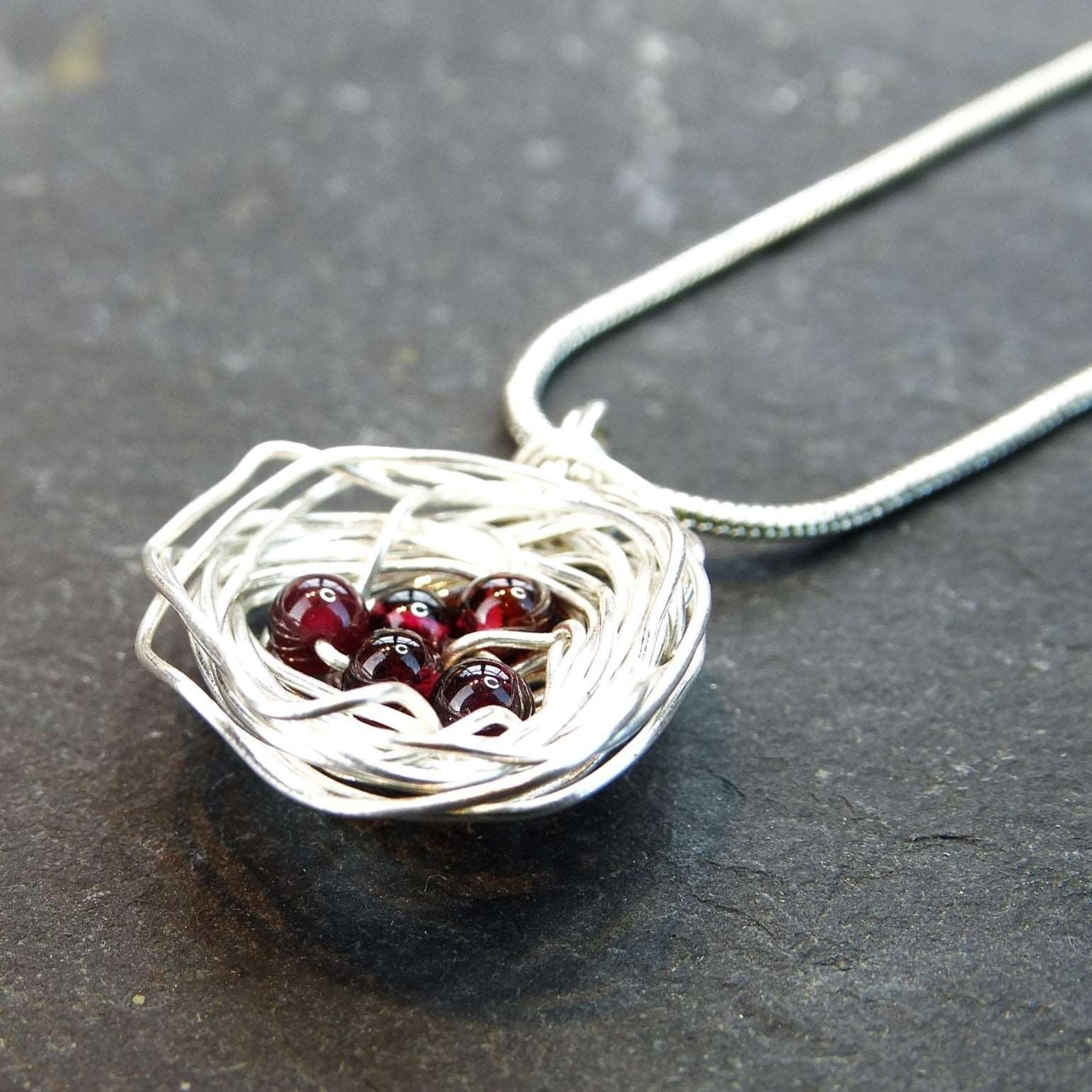 Birds nest pendant, necklace with red gemstone eggs | Necklace | Louella Jewellery