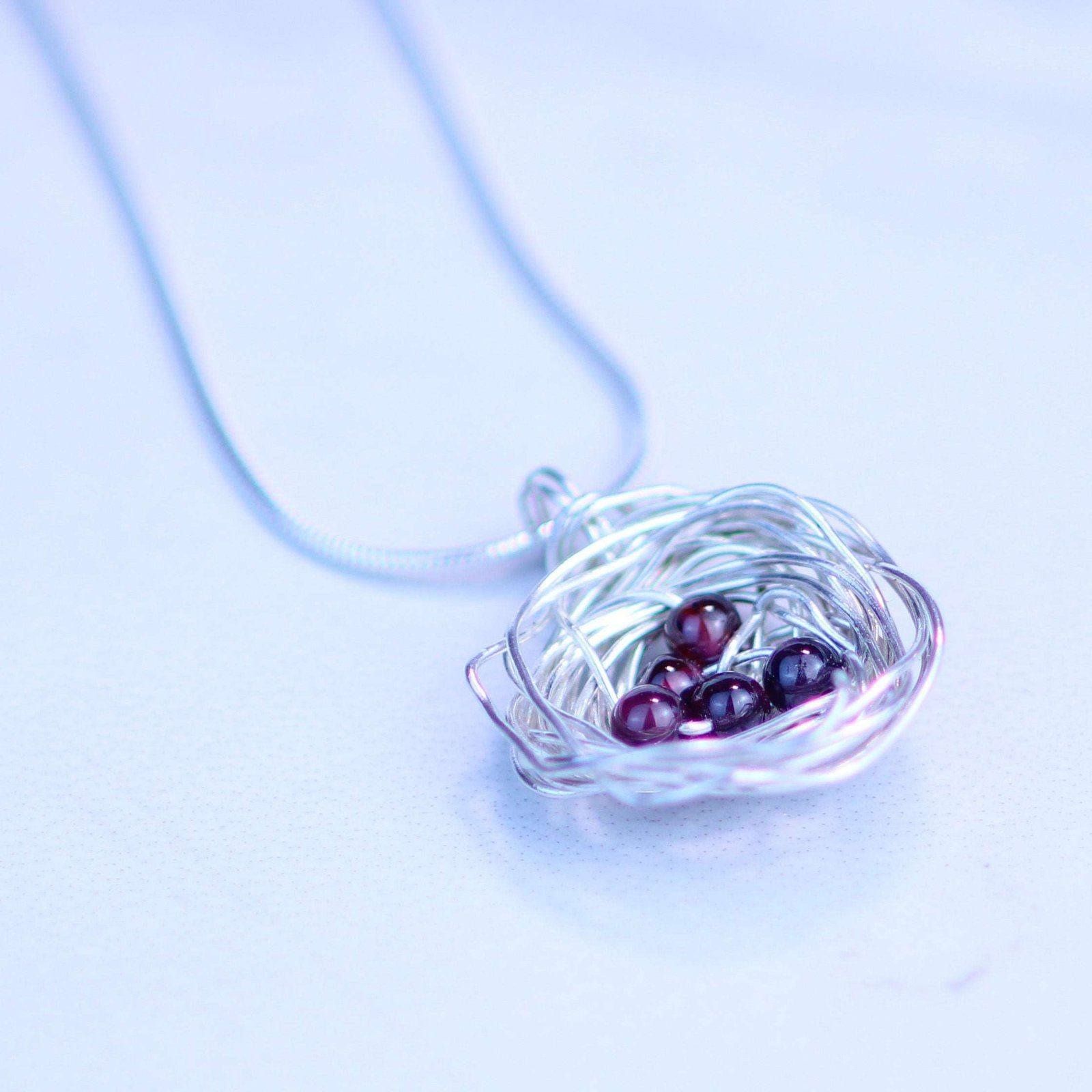 Birds nest pendant, necklace with red gemstone eggs | Necklace | Louella Jewellery