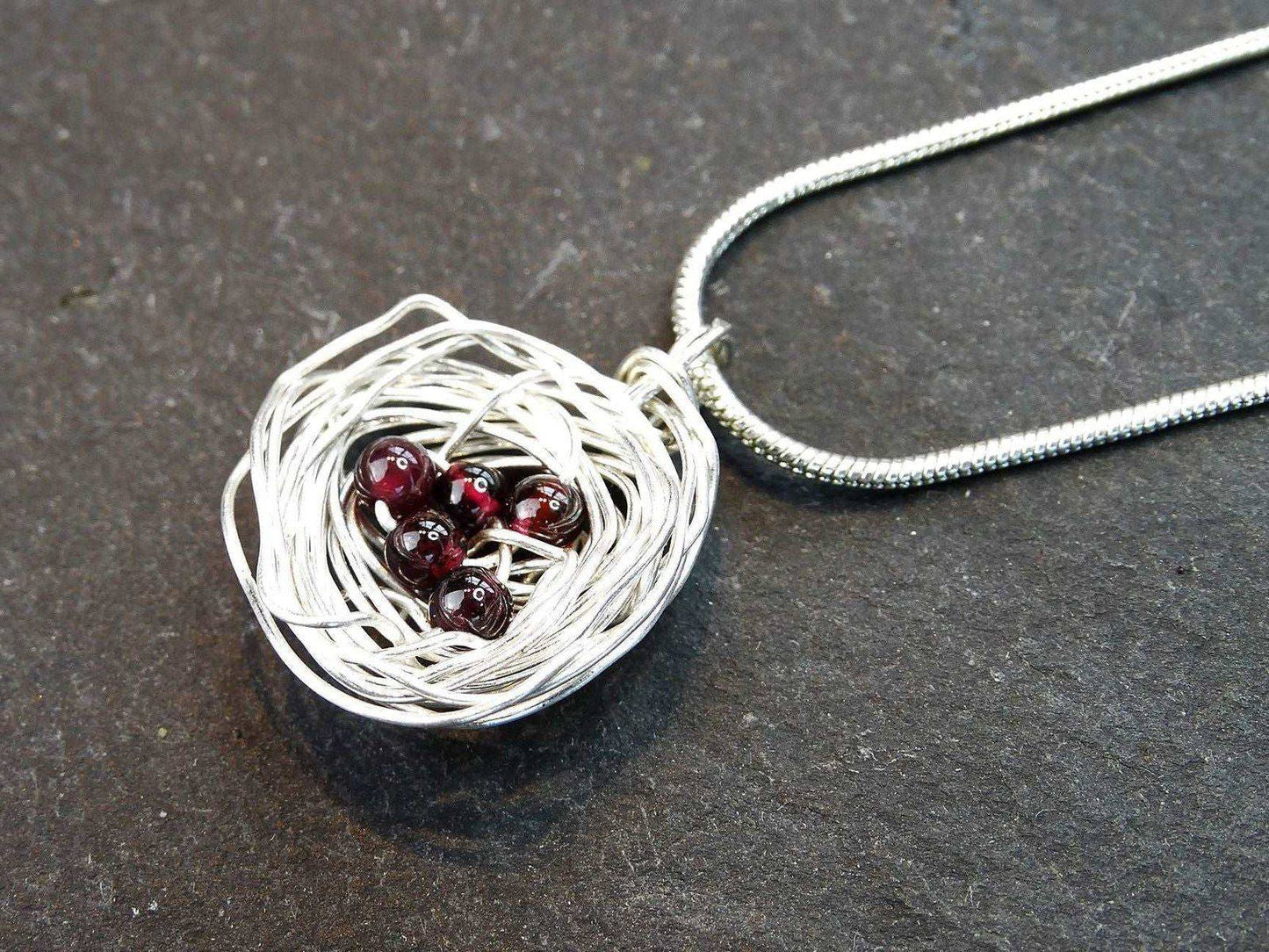 Birds nest pendant, necklace with red gemstone eggs | Necklace | Louella Jewellery