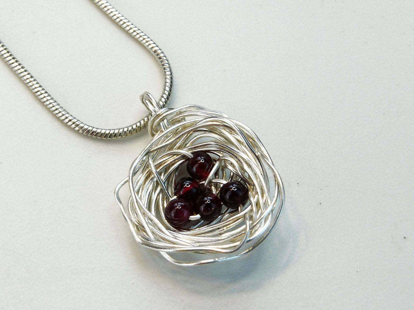 Birds nest pendant, necklace with red gemstone eggs | Necklace | Louella Jewellery