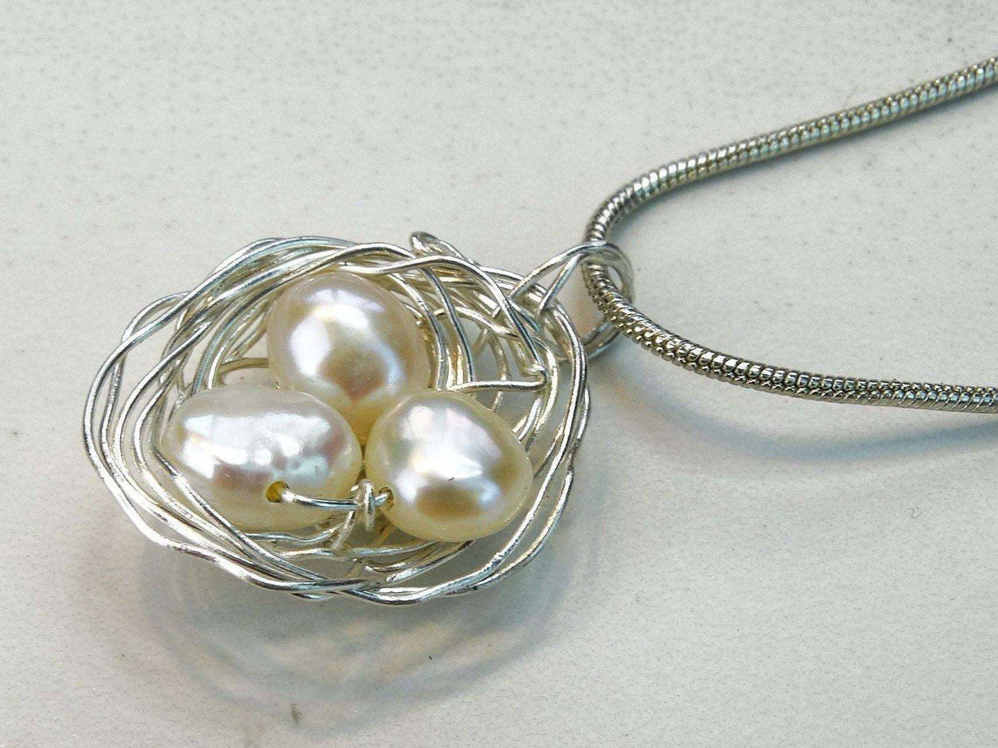 Birds nest pendant, necklace with white pearl eggs | Necklace | Louella Jewellery