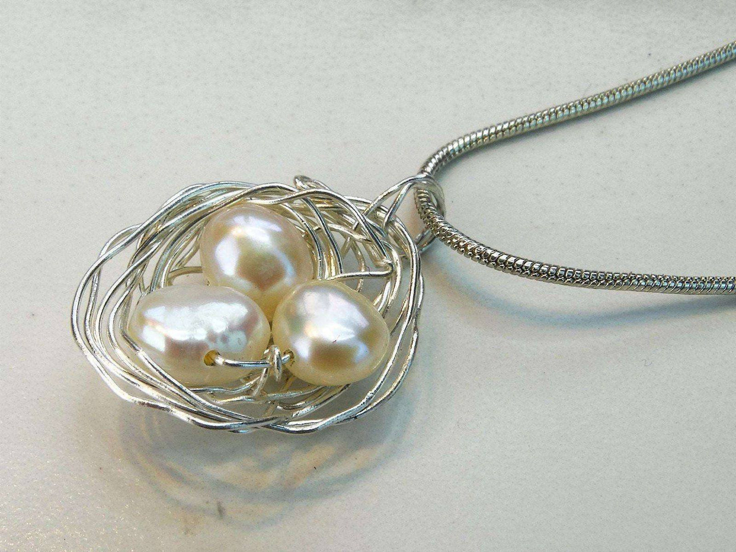 Birds nest pendant, necklace with white pearl eggs | Necklace | Louella Jewellery