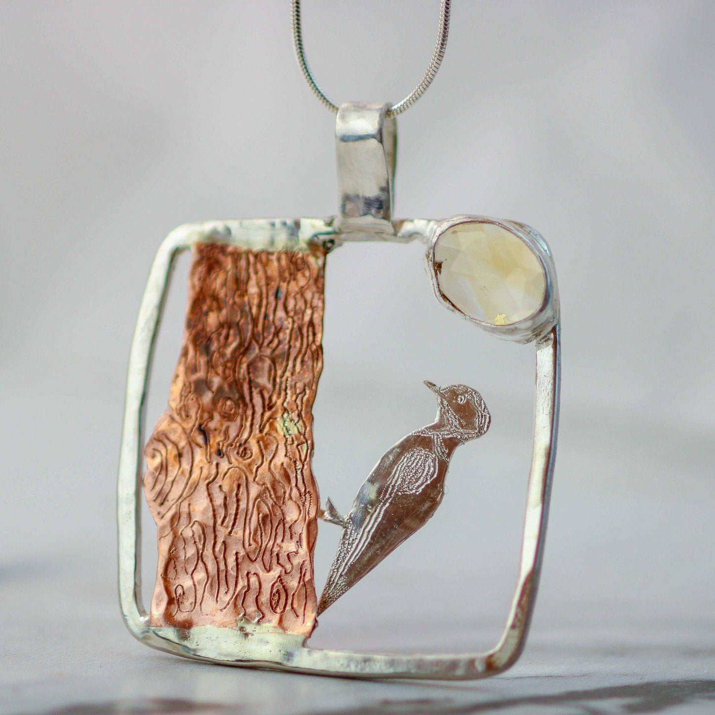 Kinetic woodpecker necklace - moving jewellery | Louella Jewellery