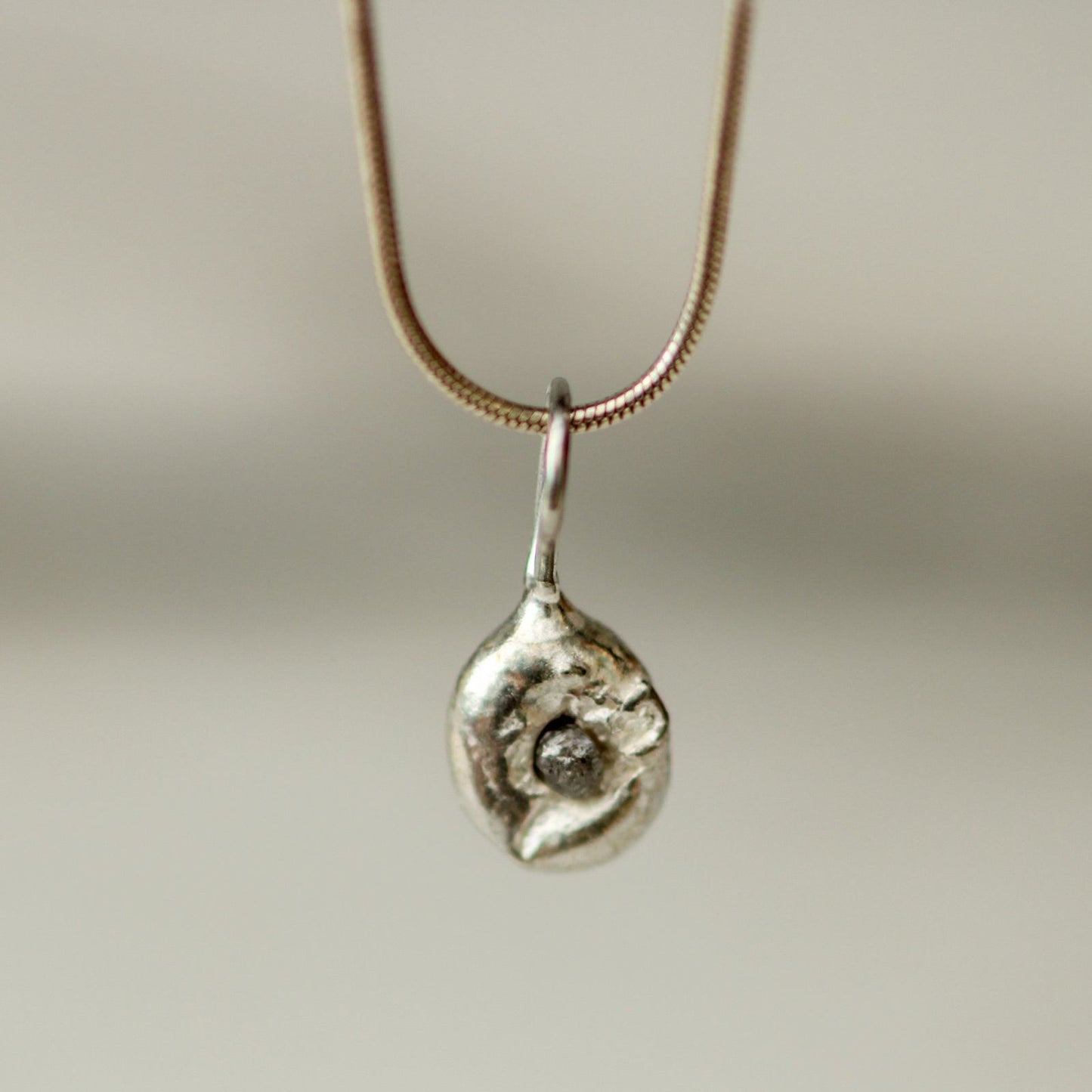 Molten silver, raw diamond pendant louella-jewellery
