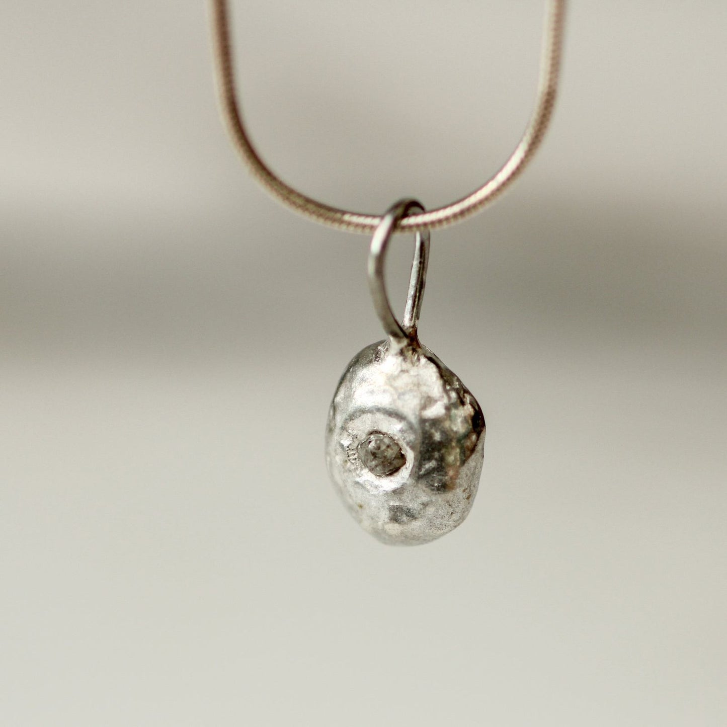 Molten silver, raw diamond pendant louella-jewellery